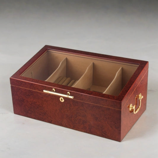 Countertop display humidor with a glass top, burl finish, and gold plated hardware accents.