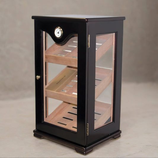Countertop display humidor tower with three angled shelves and a mounted hygrometer