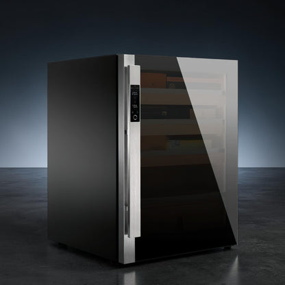 Raching DM50 Dark Matter Series small electric humidor with obsidian finish sitting in a dark room with blue backlighting