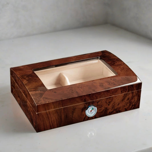 Glass top humidor with a walnut burl finish, built in hygrometer, and Spanish cedar lining.
