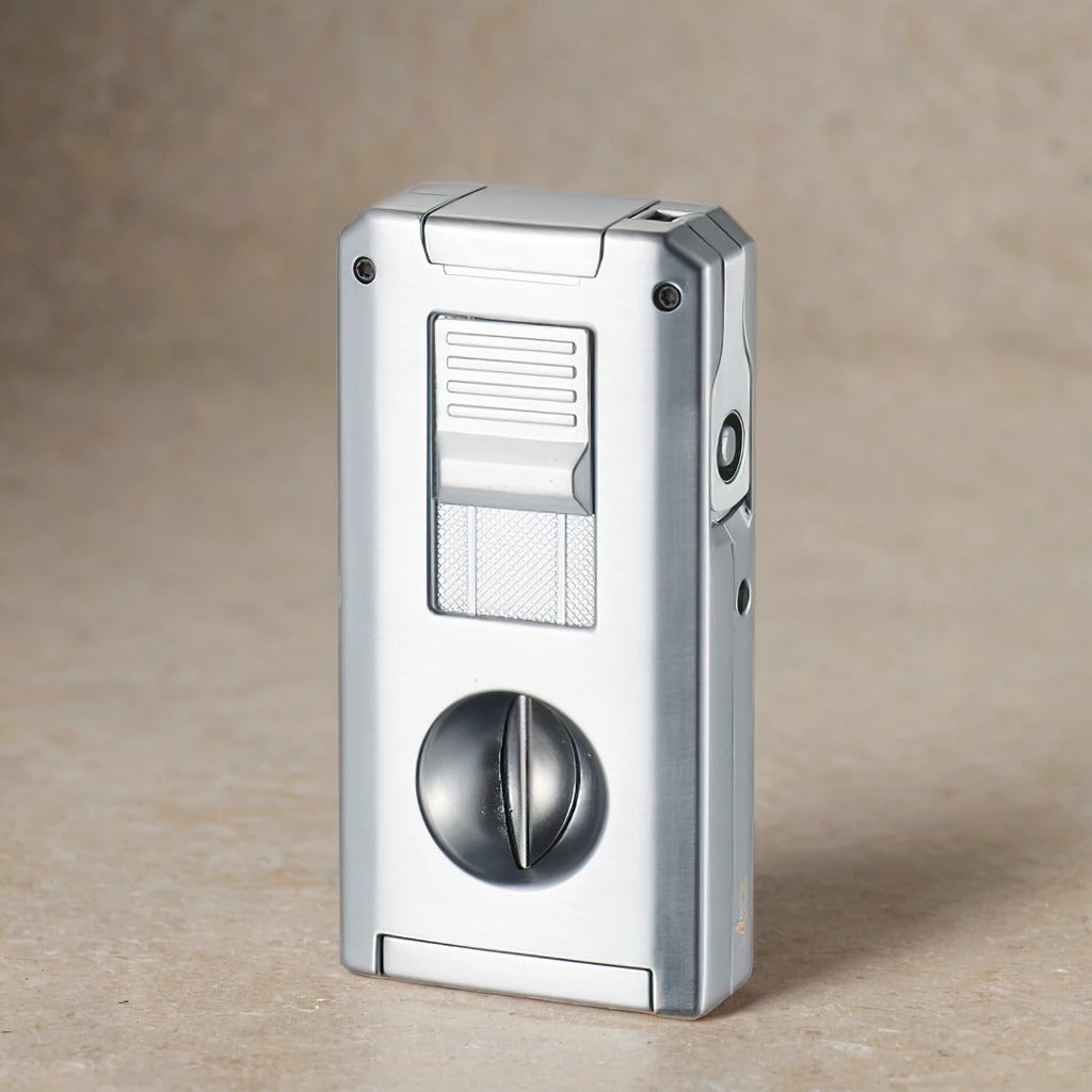 Silver cigar torch lighter and V cutter on a neutral background. 