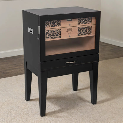 Black side table humidor with a glass panel on a carpeted floor.