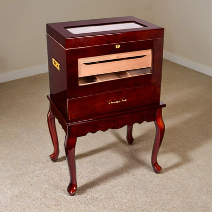 Wooden humidor table with glass top on a beige carpeted floor
