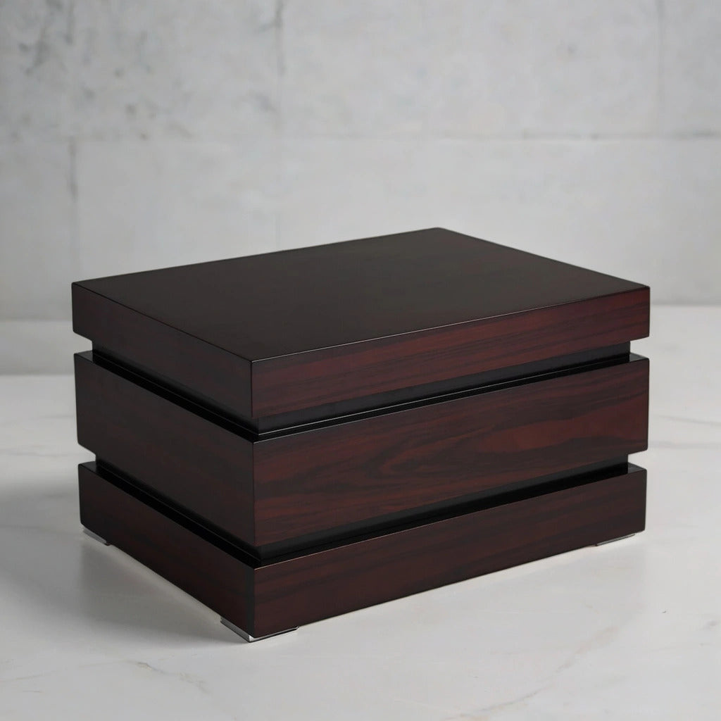 Rosewood desktop humidor box on a light gray background