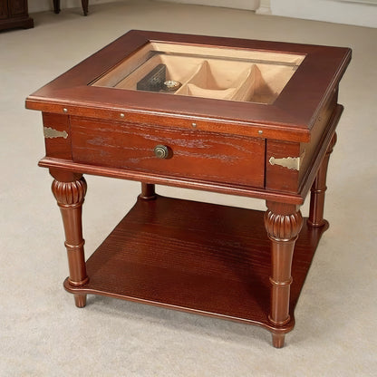 Wooden humidor table with glass top and storage compartments on a beige carpet.