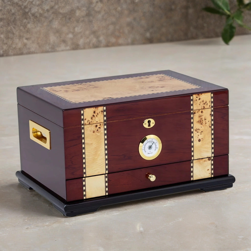 classic desktop humidor with brass accents on a neutral background