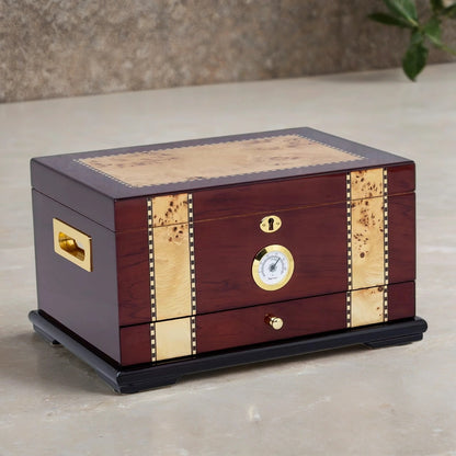classic desktop humidor with brass accents on a neutral background