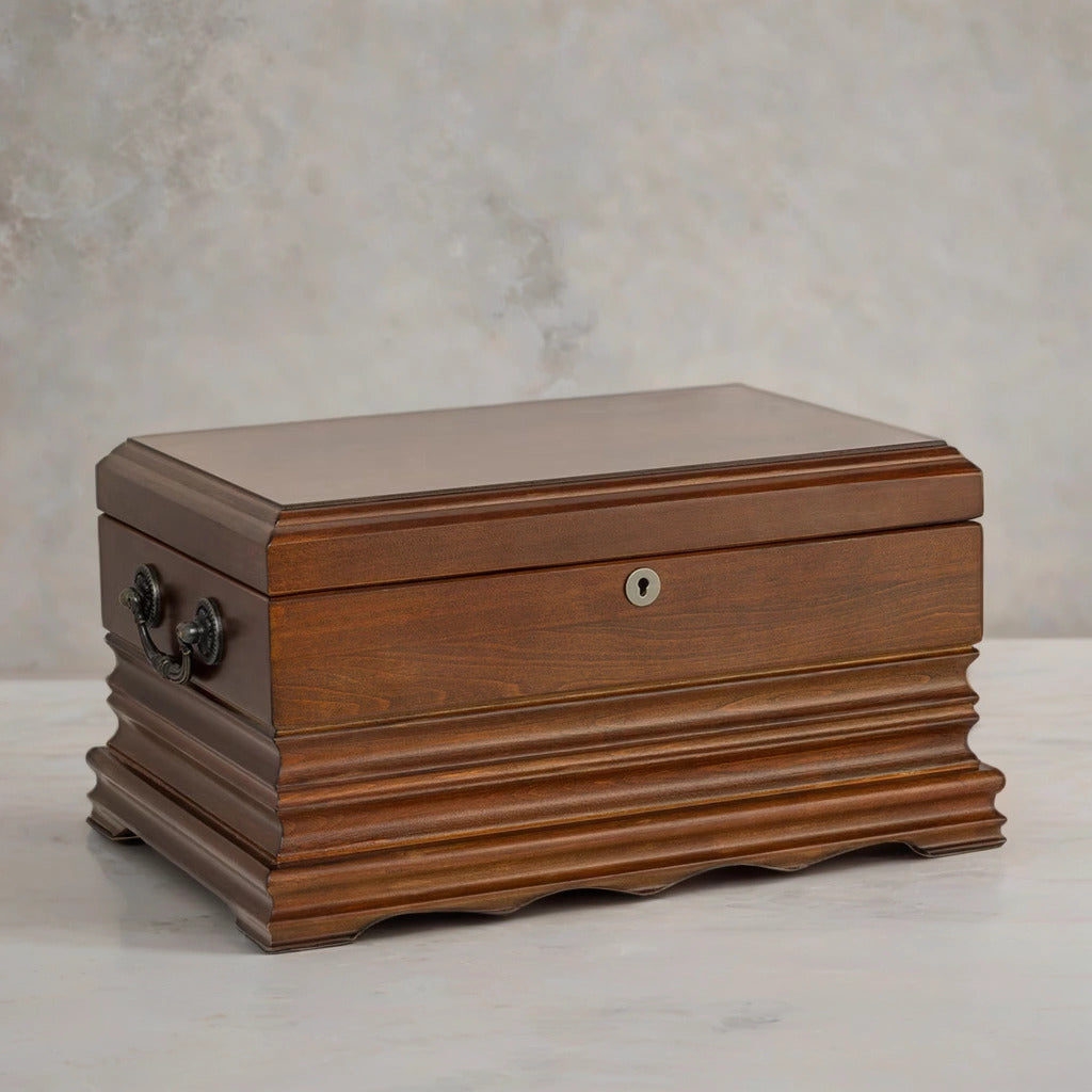Wooden desktop cigar humidor with a textured surface on a neutral background